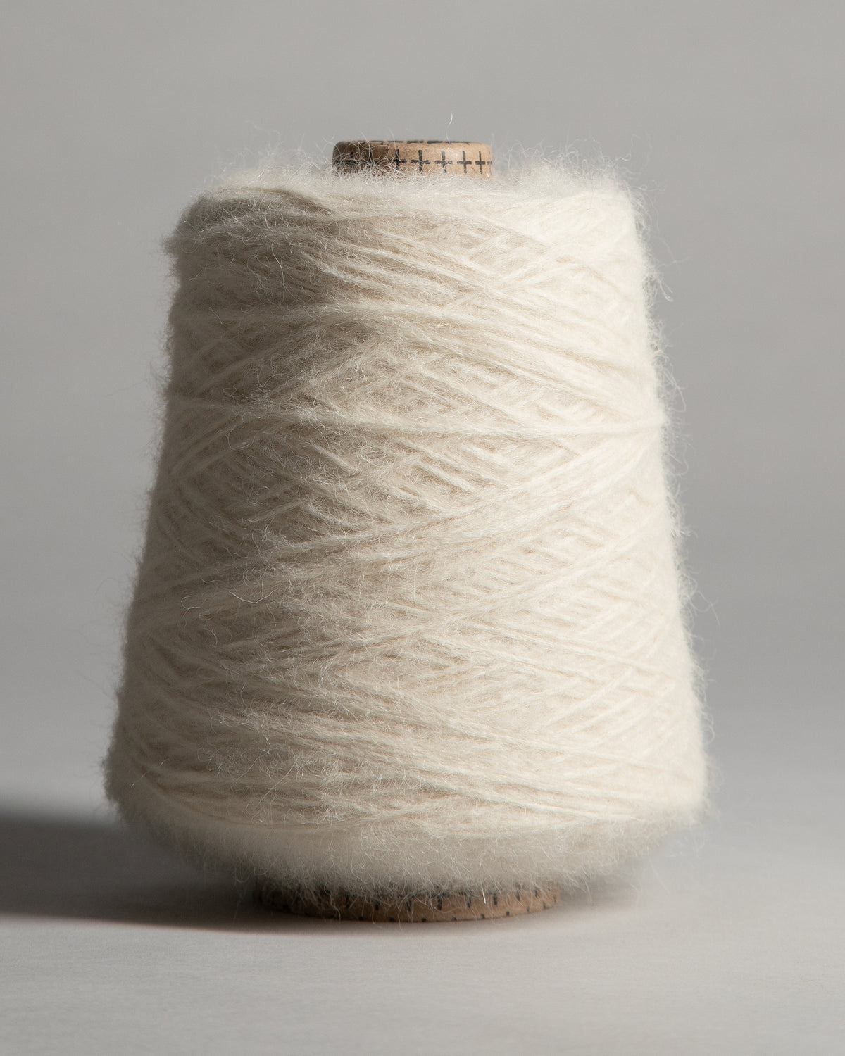 White brushed alpaca wool yarn cone